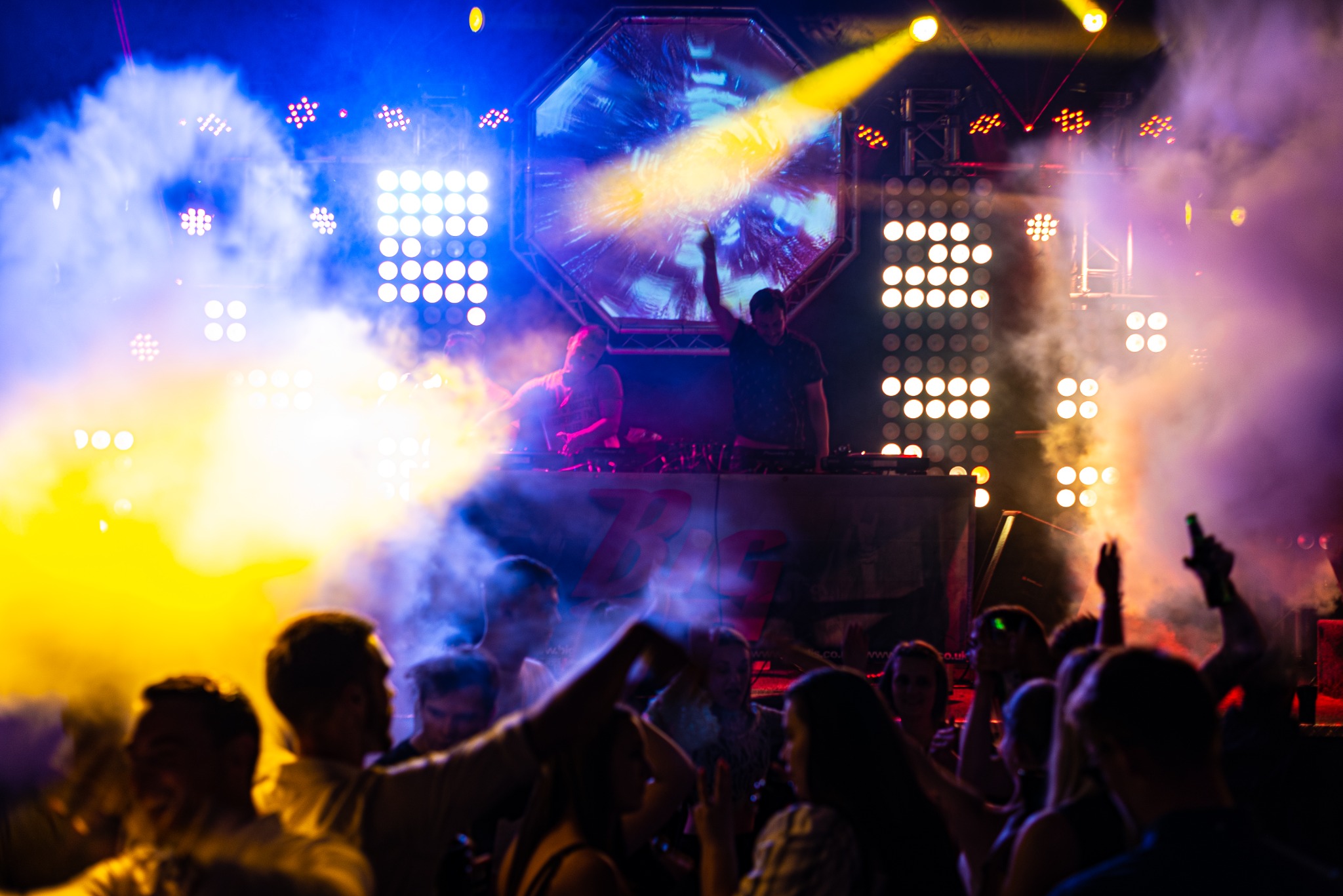 3IG 3EN performing to a packed room under full production lighting